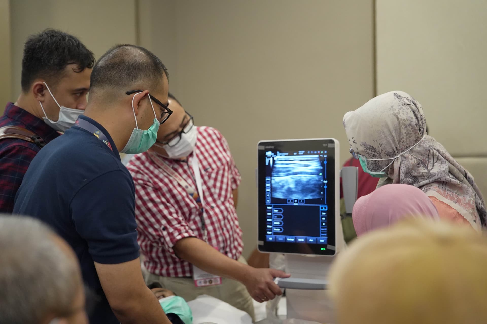 Hands-on ultrasound training session with healthcare professionals